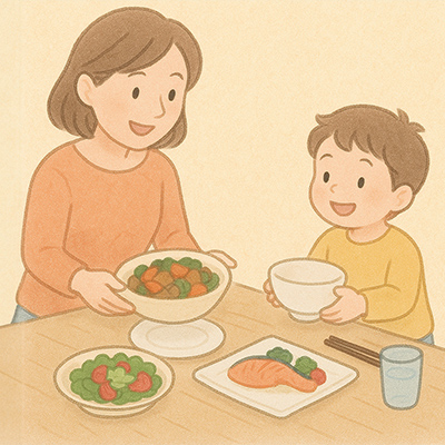 お手伝いを誘って食器を並べている親子